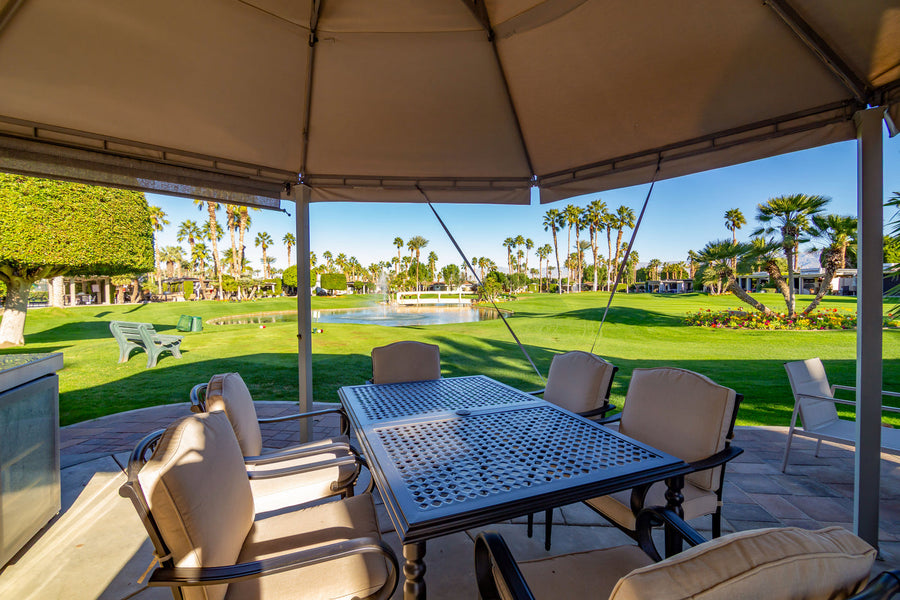 Existing patio and golf-and-lake view at ORI Lot 250